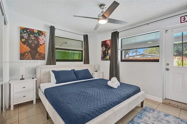 7531 Simms St, Hollywood, FL 33024 - tiled bedroom featuring a textured ceiling and a ceiling fan