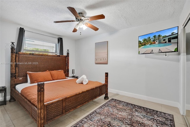 7531 Simms St, Hollywood, FL 33024 - bedroom with light tile patterned floors, a textured ceiling, a ceiling fan, and baseboards