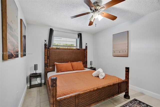 7531 Simms St, Hollywood, FL 33024 - bedroom featuring a textured ceiling, light tile patterned floors, baseboards, and ceiling fan