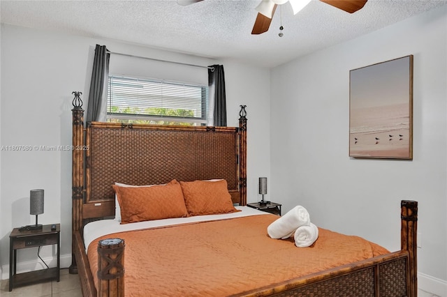 7531 Simms St, Hollywood, FL 33024 - bedroom with baseboards, light tile patterned floors, a textured ceiling, and ceiling fan