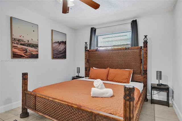 7531 Simms St, Hollywood, FL 33024 - bedroom featuring light tile patterned floors, a textured ceiling, baseboards, and a ceiling fan