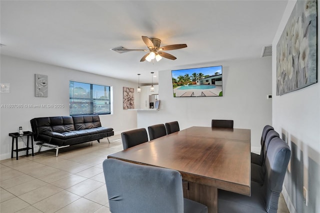 7531 Simms St, Hollywood, FL 33024 - dining area with a ceiling fan, light tile patterned floors, and baseboards