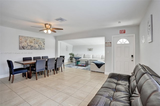 7531 Simms St, Hollywood, FL 33024 - dining room with ceiling fan, light tile patterned floors, and baseboards