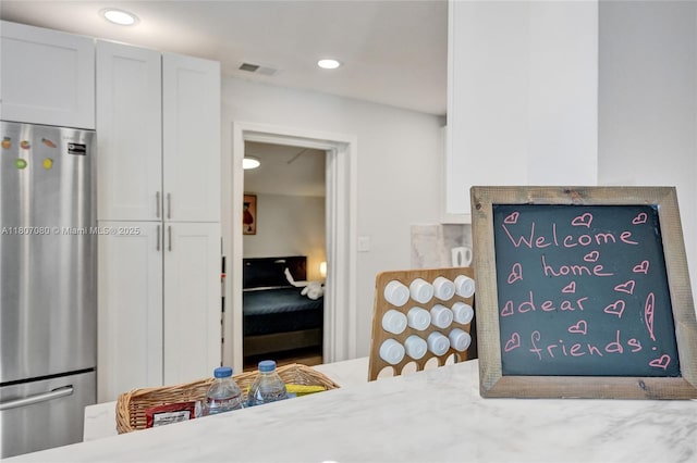 7531 Simms St, Hollywood, FL 33024 - detailed view of freestanding refrigerator and recessed lighting