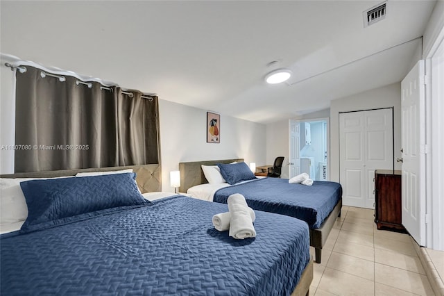 7531 Simms St, Hollywood, FL 33024 - bedroom with light tile patterned floors, lofted ceiling, and connected bathroom