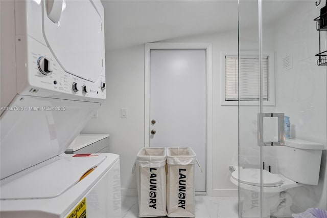 7531 Simms St, Hollywood, FL 33024 - laundry area with marble look tiles and stacked washer / drying machine