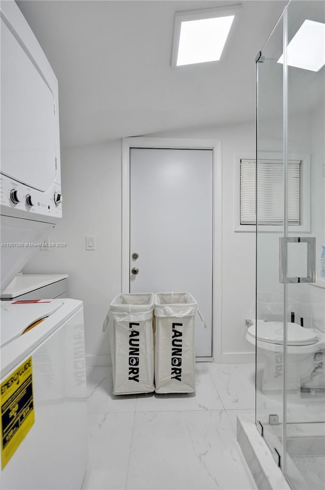 7531 Simms St, Hollywood, FL 33024 - laundry area featuring stacked washer / dryer and light marble finish floors