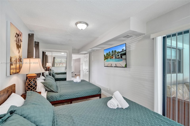 7531 Simms St, Hollywood, FL 33024 - bedroom with a textured ceiling
