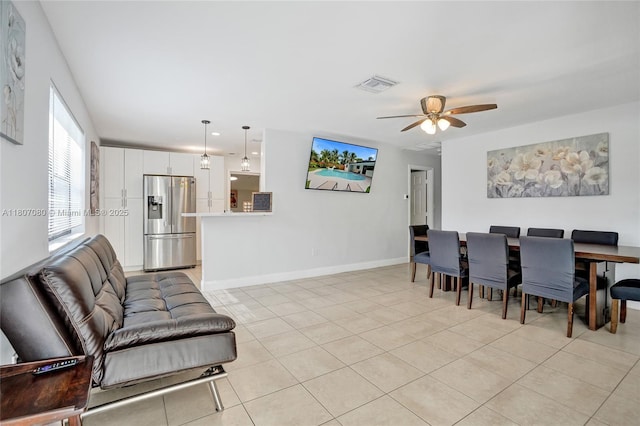 7531 Simms St, Hollywood, FL 33024 - living room featuring ceiling fan, light tile patterned flooring, and baseboards