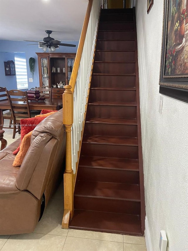 1560 W 46th St Unit 229, Hialeah, FL 33012 - stairs with a textured wall, ceiling fan, and tile patterned flooring