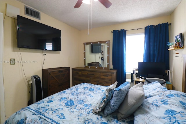 1560 W 46th St Unit 229, Hialeah, FL 33012 - bedroom with a textured ceiling and a ceiling fan