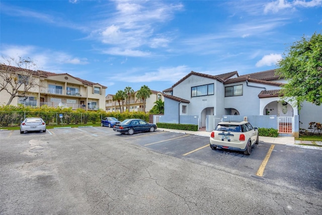 9033 SW 123rd Ct Unit 101, Miami, FL 33186 - uncovered parking lot featuring a residential view