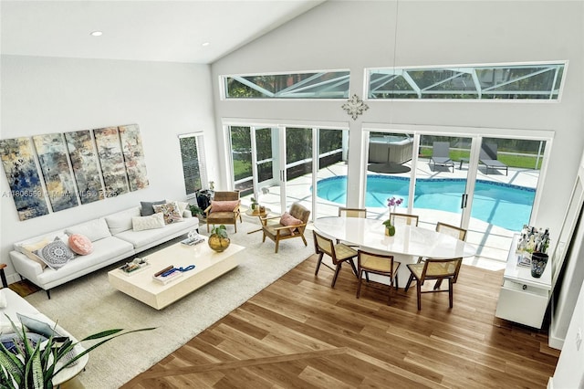 594 Spinnaker, Weston, FL 33326 - living area with high vaulted ceiling, wood finished floors, plenty of natural light, and recessed lighting