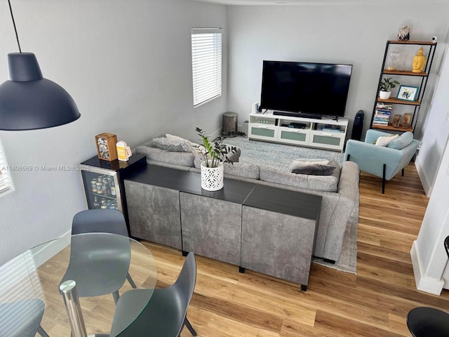 594 Spinnaker, Weston, FL 33326 - living area featuring wood finished floors and baseboards