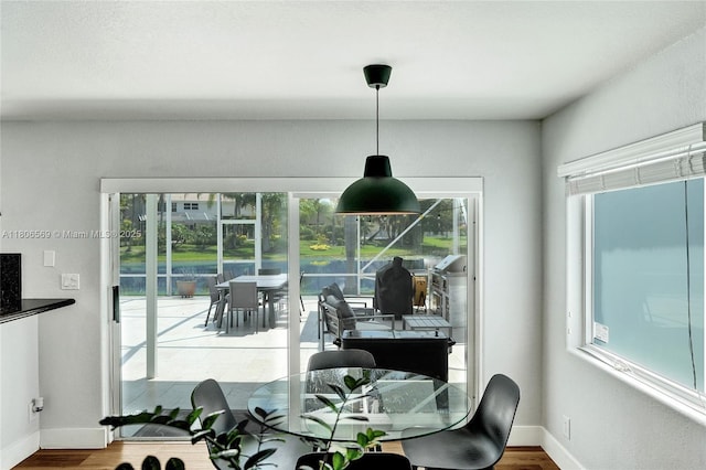 594 Spinnaker, Weston, FL 33326 - dining space with wood finished floors and baseboards