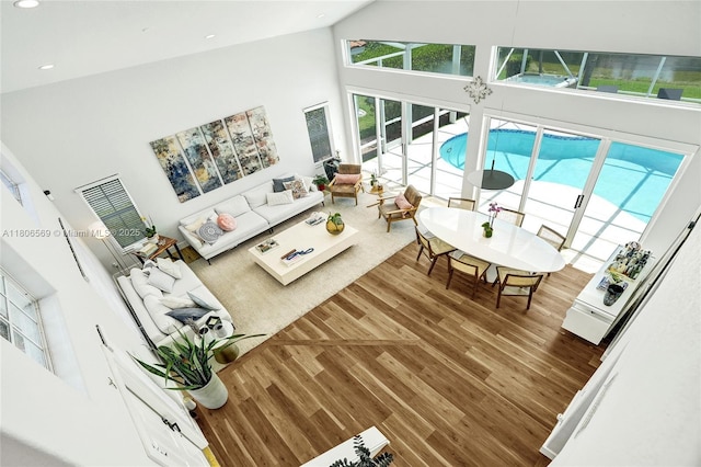 594 Spinnaker, Weston, FL 33326 - living room featuring a towering ceiling, wood finished floors, and recessed lighting