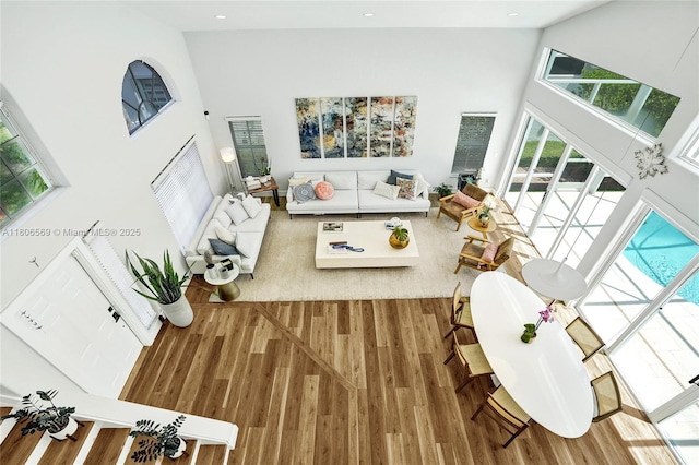 594 Spinnaker, Weston, FL 33326 - living area featuring high vaulted ceiling, wood finished floors, and recessed lighting