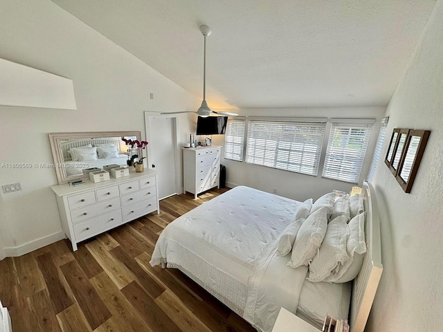 594 Spinnaker, Weston, FL 33326 - bedroom with dark wood finished floors, lofted ceiling, baseboards, and a textured ceiling