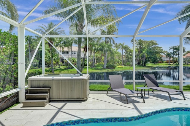 594 Spinnaker, Weston, FL 33326 - view of swimming pool featuring a hot tub, a patio, a water view, and glass enclosure