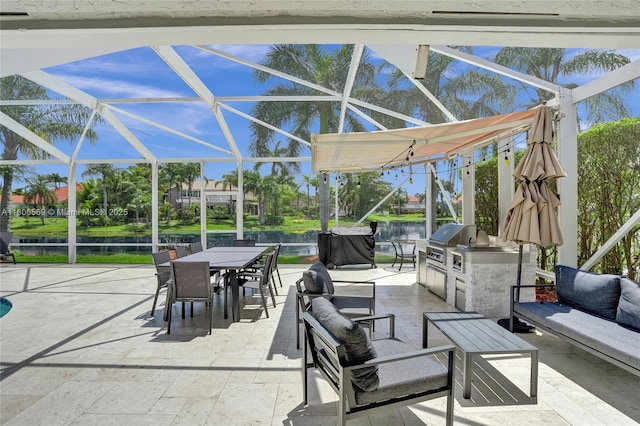 594 Spinnaker, Weston, FL 33326 - view of patio with outdoor dining area, outdoor lounge area, a water view, and glass enclosure