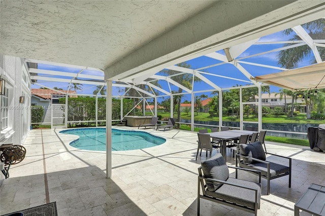 594 Spinnaker, Weston, FL 33326 - view of pool with a patio, glass enclosure, and outdoor dining space