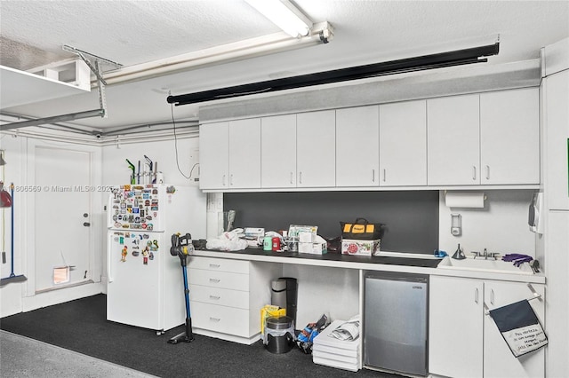 594 Spinnaker, Weston, FL 33326 - garage with freestanding refrigerator, refrigerator, and a sink