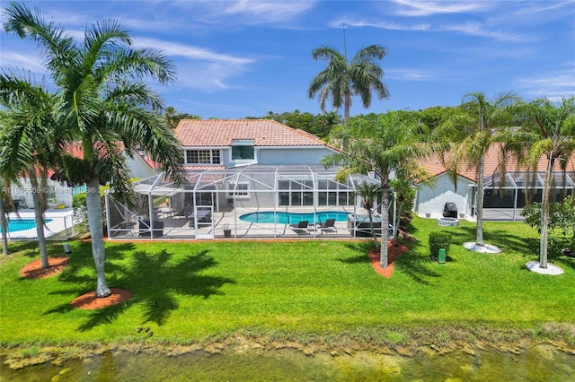 594 Spinnaker, Weston, FL 33326 - rear view of house featuring an outdoor pool, a tile roof, a yard, and a lanai