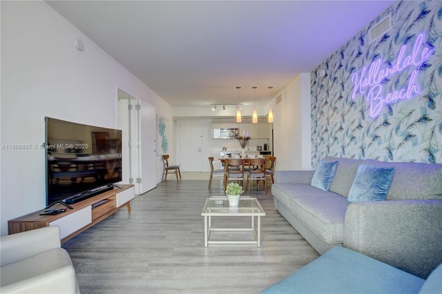 2602 E Hallandale Beach Blvd Unit R407, Hallandale Beach, FL 33009 - living area featuring wood finished floors and track lighting