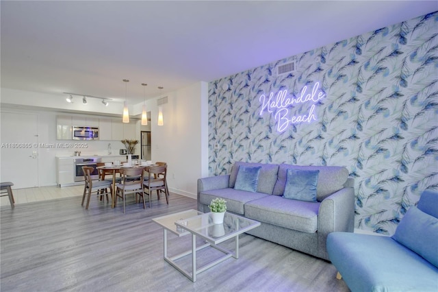 2602 E Hallandale Beach Blvd Unit R407, Hallandale Beach, FL 33009 - living room with light wood finished floors and baseboards