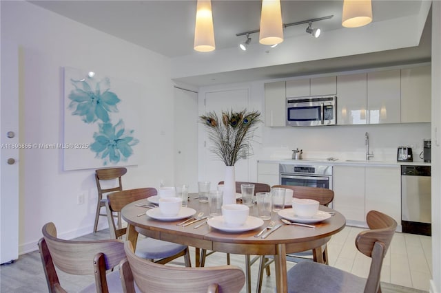 2602 E Hallandale Beach Blvd Unit R407, Hallandale Beach, FL 33009 - dining space with rail lighting