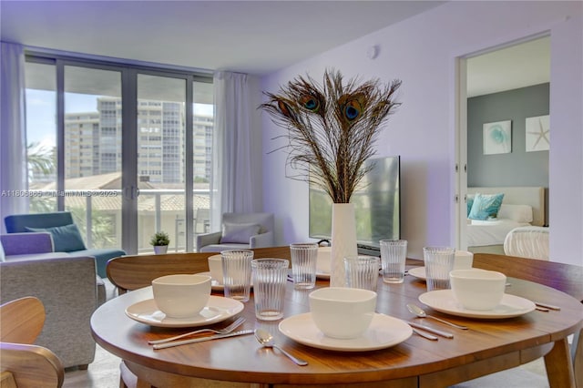 2602 E Hallandale Beach Blvd Unit R407, Hallandale Beach, FL 33009 - dining space featuring a wall of windows