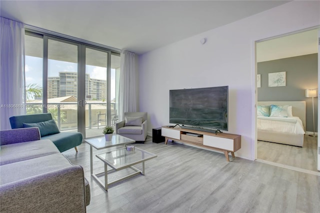 2602 E Hallandale Beach Blvd Unit R407, Hallandale Beach, FL 33009 - living area featuring wood finished floors and expansive windows