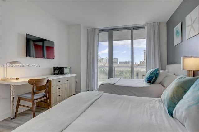 2602 E Hallandale Beach Blvd Unit R407, Hallandale Beach, FL 33009 - bedroom with light wood finished floors