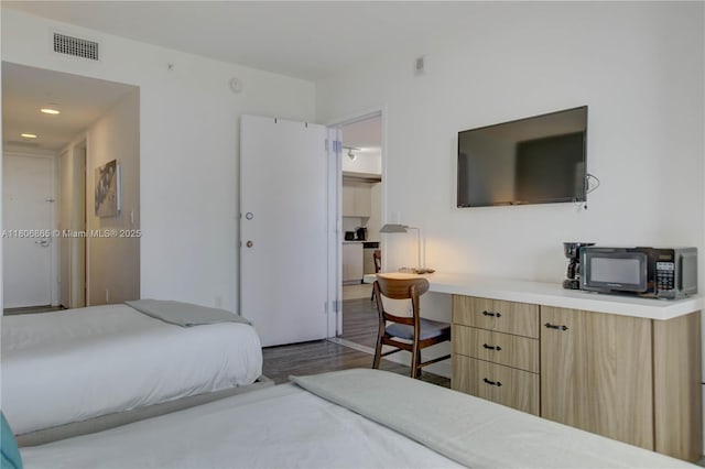 2602 E Hallandale Beach Blvd Unit R407, Hallandale Beach, FL 33009 - bedroom featuring dark wood-type flooring and built in study area