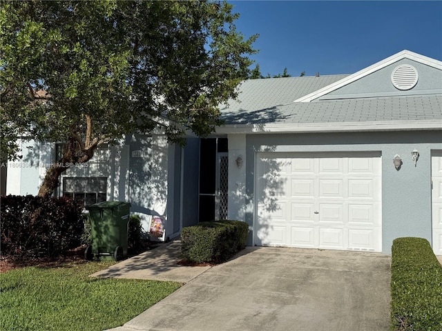 737 SE 22nd Dr, Homestead, FL 33033 - view of front of property featuring a garage, concrete driveway, and stucco siding