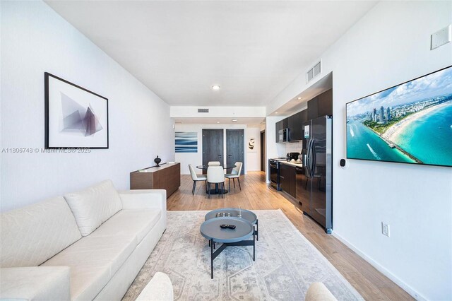398 NE 5th St Unit 4518, Miami, FL 33132 - living area with light wood-style flooring, baseboards, and recessed lighting