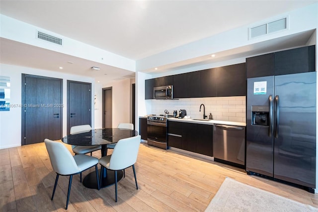 398 NE 5th St Unit 4518, Miami, FL 33132 - dining space featuring light wood finished floors and recessed lighting