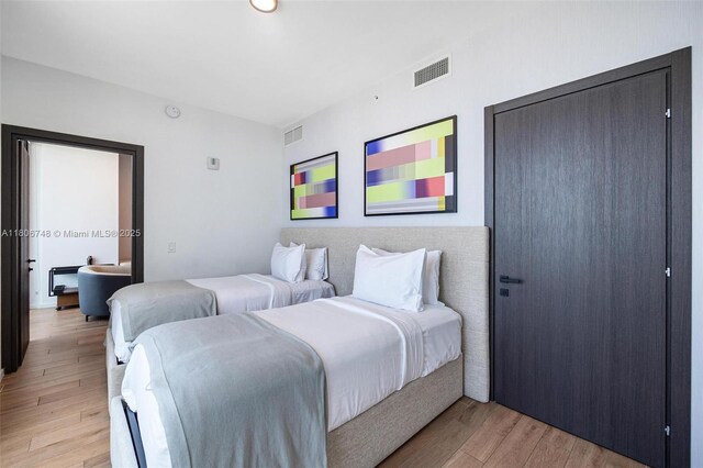 398 NE 5th St Unit 4518, Miami, FL 33132 - bedroom featuring light wood-style flooring