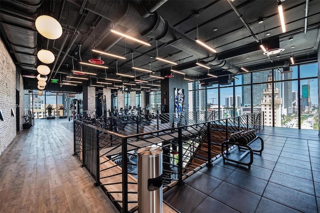 398 NE 5th St Unit 4518, Miami, FL 33132 - corridor with a view of city, brick wall, and wood finished floors
