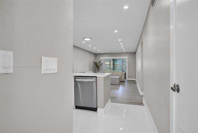 100 Ashbury Rd Unit 103, Hollywood, FL 33024 - kitchen with dishwasher, baseboards, light countertops, recessed lighting, and light tile patterned flooring