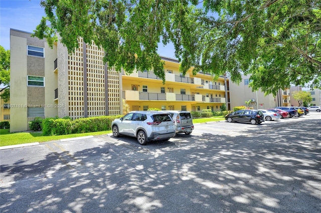 100 Ashbury Rd Unit 103, Hollywood, FL 33024 - view of apartment building / complex featuring uncovered parking