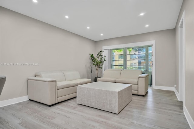 100 Ashbury Rd Unit 103, Hollywood, FL 33024 - living area featuring light wood-style flooring, baseboards, and recessed lighting
