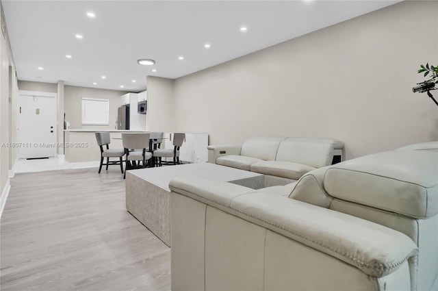 100 Ashbury Rd Unit 103, Hollywood, FL 33024 - living room with light wood-style floors, recessed lighting, and baseboards