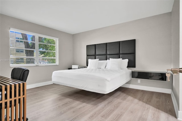 100 Ashbury Rd Unit 103, Hollywood, FL 33024 - bedroom featuring wood finished floors and baseboards