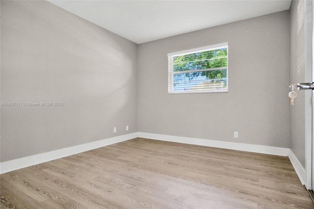 100 Ashbury Rd Unit 103, Hollywood, FL 33024 - spare room with baseboards and wood finished floors