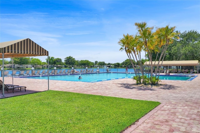 100 Ashbury Rd Unit 103, Hollywood, FL 33024 - community pool with a lawn and a patio area