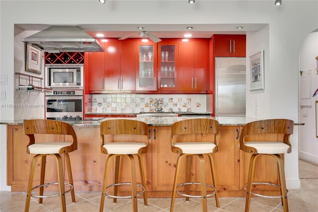 200 Ocean Lane Dr Unit 305, Key Biscayne, FL 33149 - bar area with built in appliances, range hood, decorative backsplash, recessed lighting, and a ceiling fan