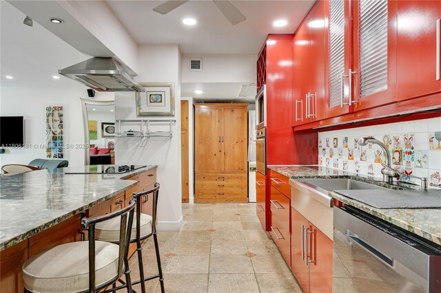 200 Ocean Lane Dr Unit 305, Key Biscayne, FL 33149 - kitchen featuring appliances with stainless steel finishes, reddish brown cabinets, recessed lighting, a ceiling fan, and a sink