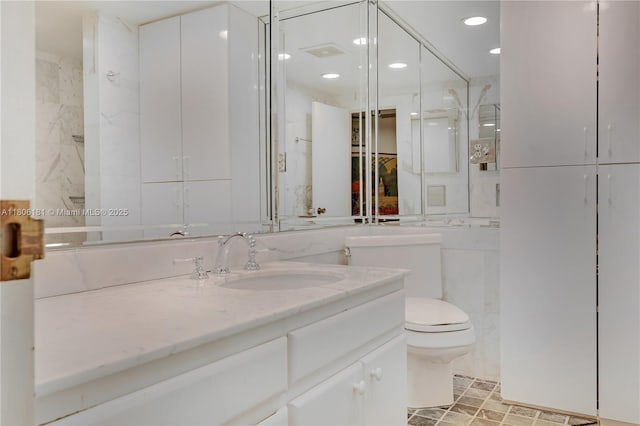 200 Ocean Lane Dr Unit 305, Key Biscayne, FL 33149 - full bathroom featuring toilet, vanity, and recessed lighting