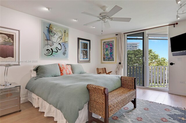 200 Ocean Lane Dr Unit 305, Key Biscayne, FL 33149 - bedroom featuring access to exterior, wood finished floors, and a ceiling fan